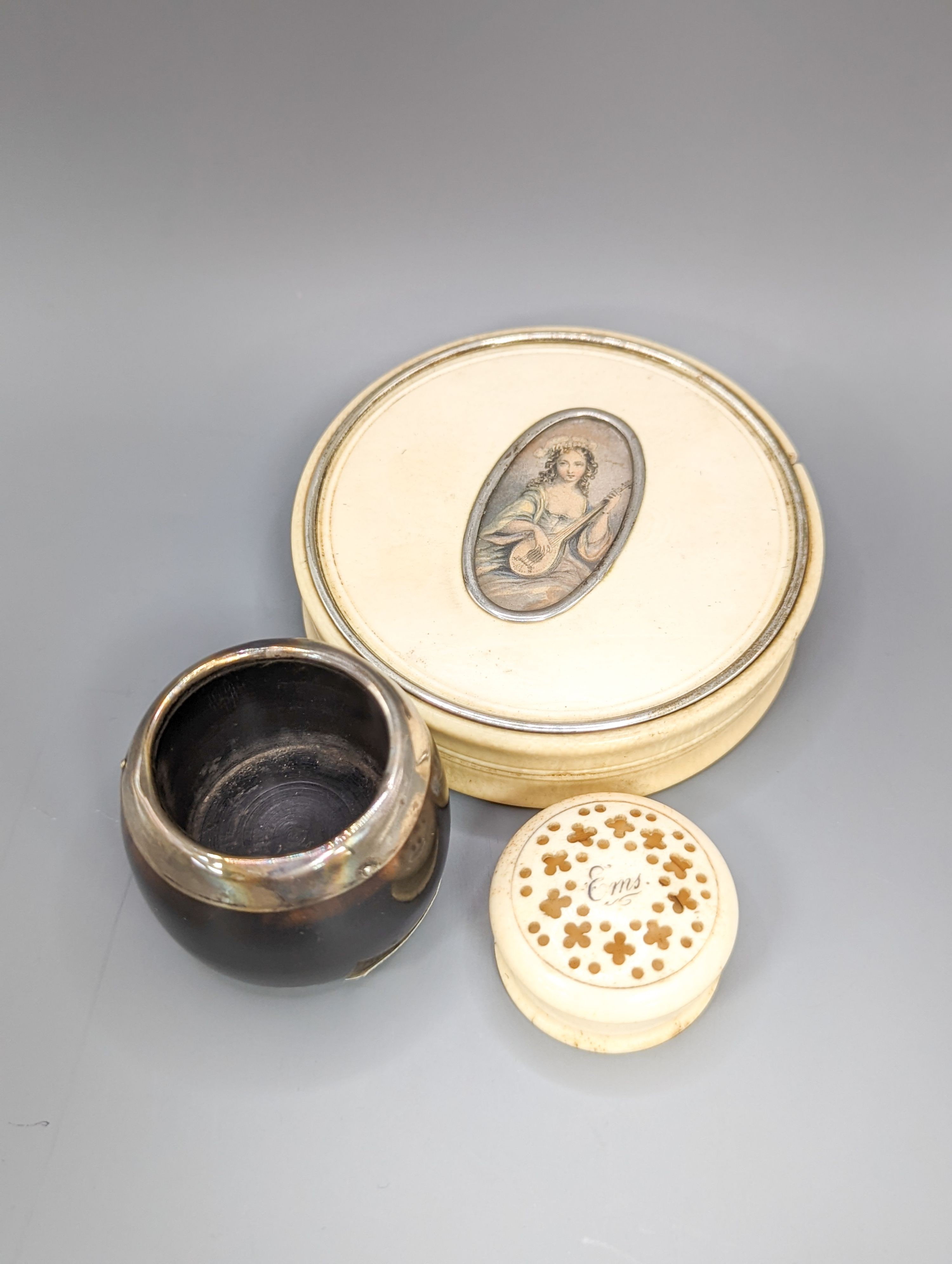 An early 19th century ivory circular box with central cartouche, a tortoiseshell match holder, diameter 9cm, and a pierced pot